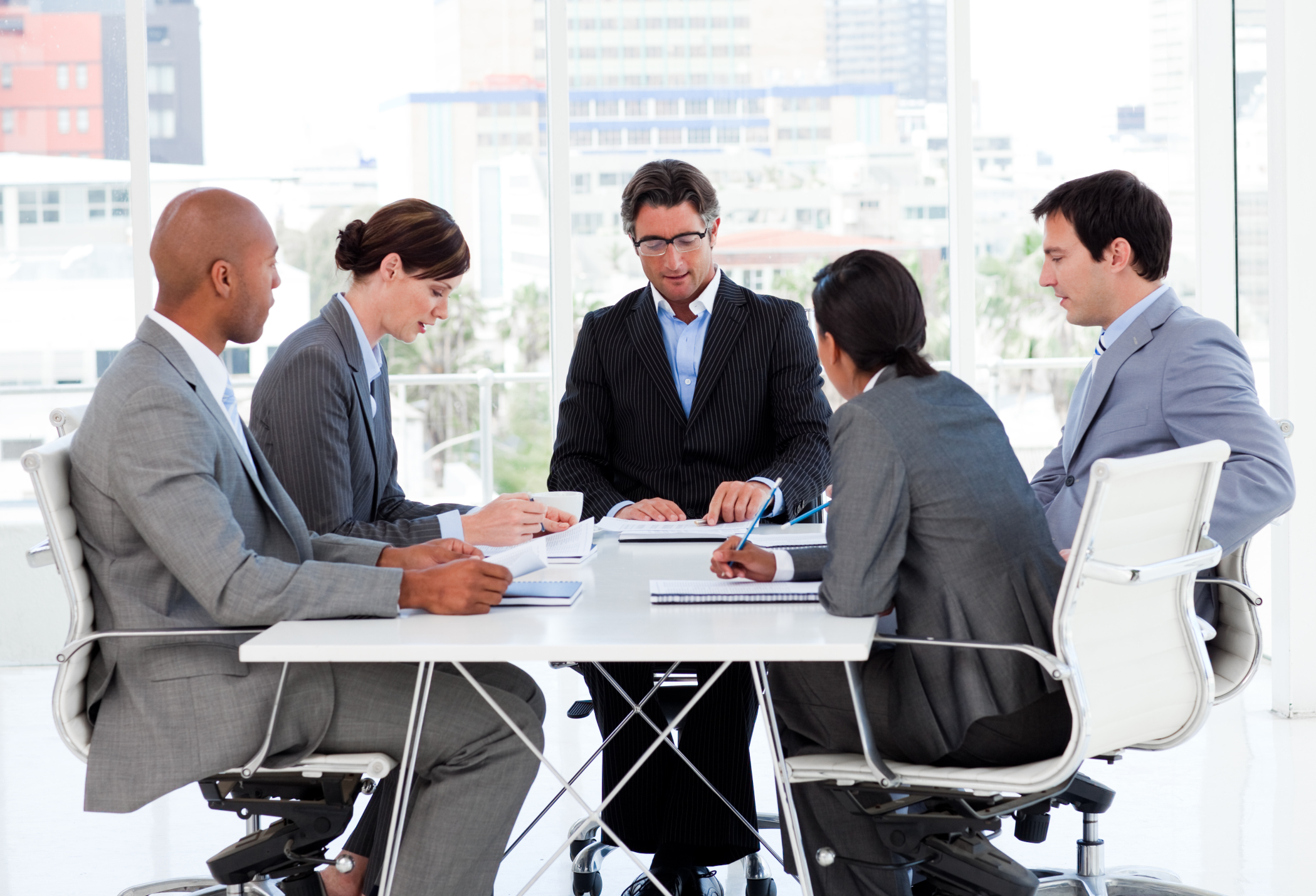 A diverse business group disscussing a budget plan